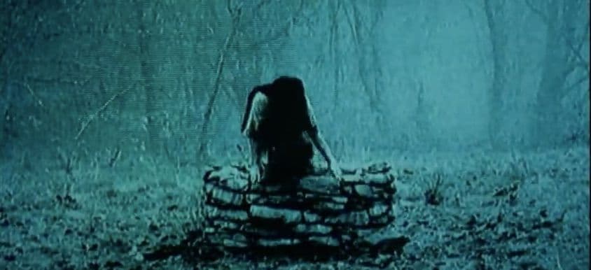 A picture of Samara climbing out of a well