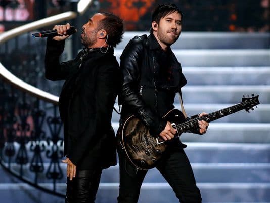 A picture of the singer and guitarist of Camila